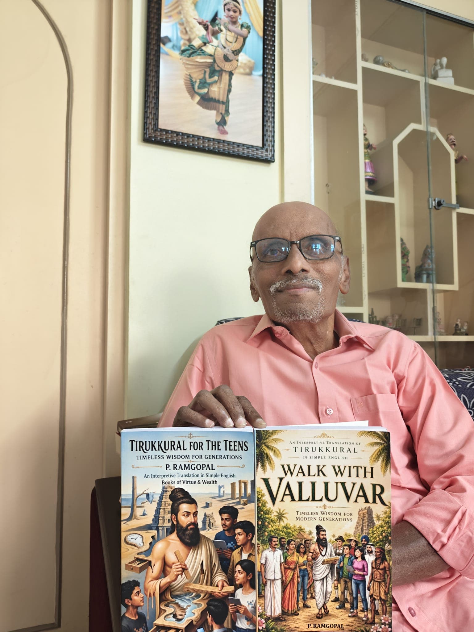 Author P. Ramgopal holding his published books, Tirukkural for the Teens and Walk with Valluvar, published by Ritera