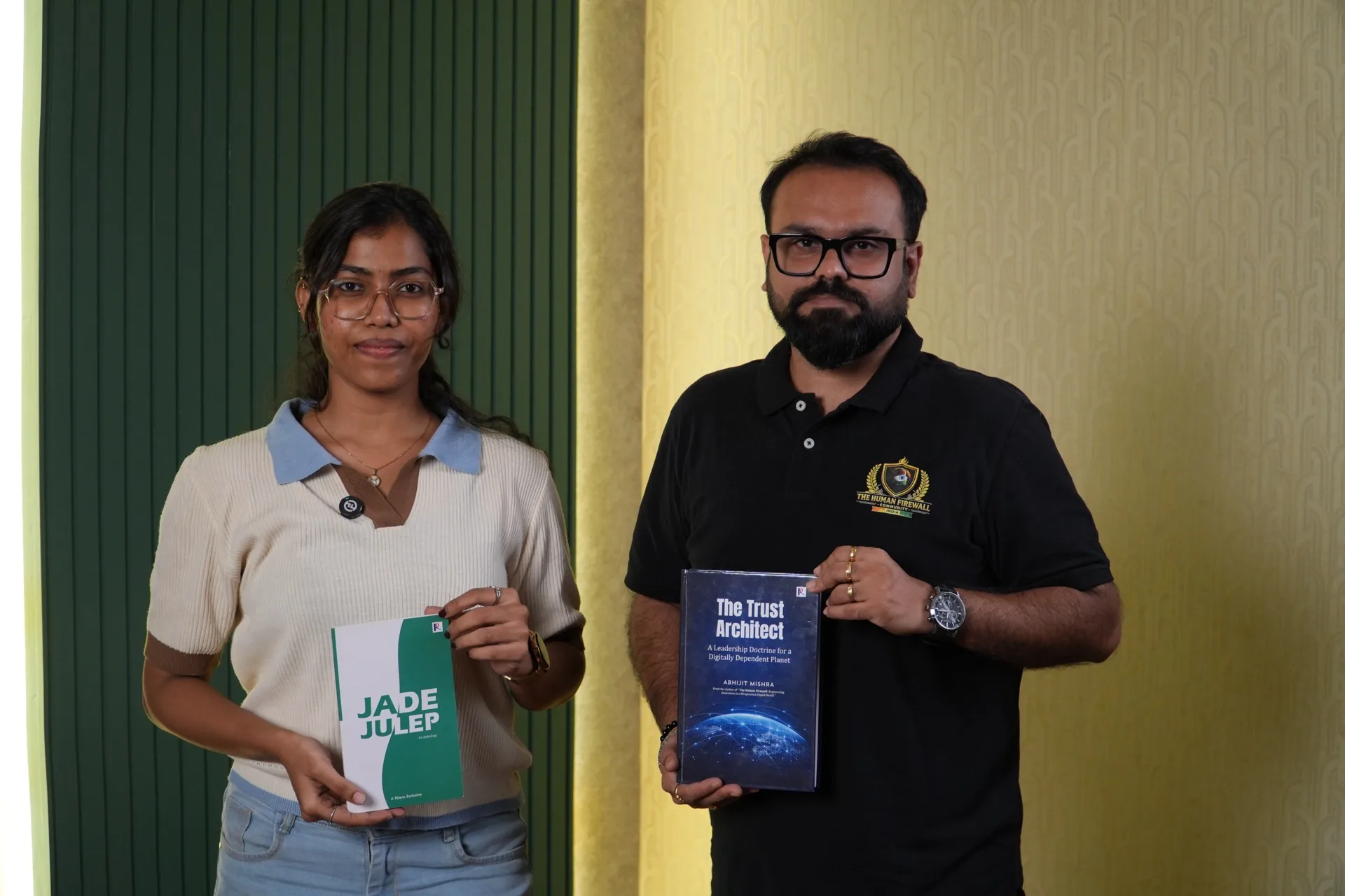 Two Ritera Publishing authors proudly holding their published books.